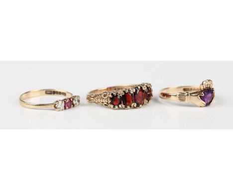 A 9ct gold and garnet five stone ring, claw set with a row of graduated oval cut garnets, London 1978, ring size approx S, a 