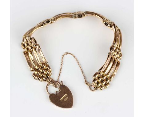 A gold gate bracelet in a curved bar and oval link design, detailed '9ct', on a gold heart shaped padlock clasp, detailed ‘9c
