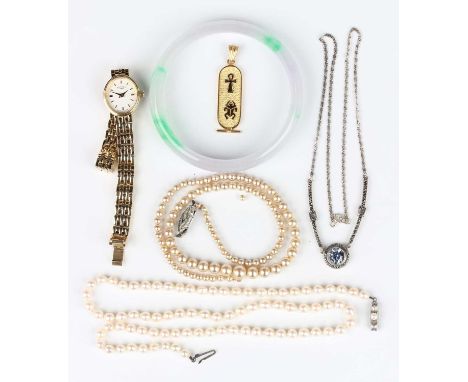 An Egyptian gold pendant decorated with hieroglyphics, weight 4.6g, length 4.4cm, a silver marcasite and pale blue paste neck