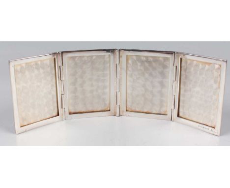 An Elizabeth II silver four-fold travelling photograph frame of rectangular form with engine turned decoration, London 1988 b
