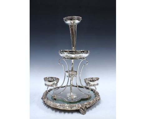 Silver plated flower epergne centrepiece, 52cm, sitting on a mirrored plateau stand with fruit and vine border, 40cm diameter
