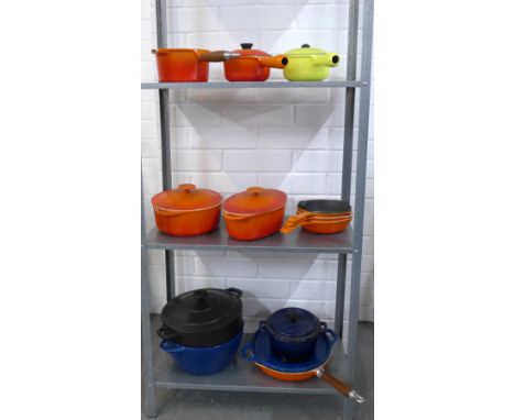 Collection of enamelled cast iron cookware, including two small orange Le Crueset pans, together with a Mason Cash ceramic po