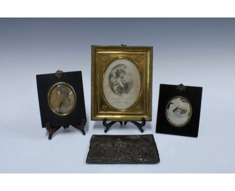Bronze cherub plaque and three framed portrait miniature prints, (4)