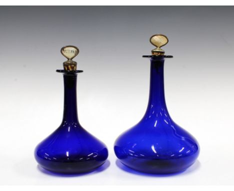 Two Bristol blue glass decanters, with mother of pearl cork stoppers for 'Whiskey' and 'Brandy, taller 24cm (2)