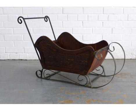A sleigh/sledge planter, 86 x 51 x 34cm.