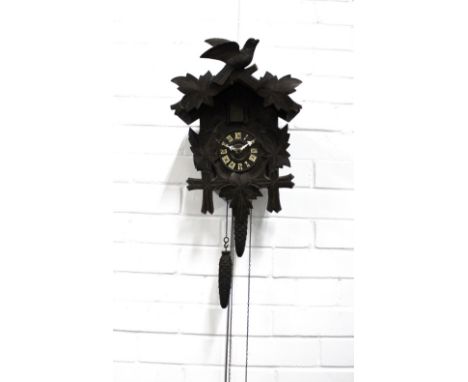 Vintage Cuckoo wall clock, carved with leaves with pine cone weights, 27 x 38cm