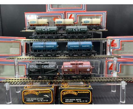 Nine Boxed OO gauge Tanker wagons Lime (7) and Mainline(700g)Lima 305641W 6 wheel Milk tanker 'St Ivel' (3)Lima 305644W 6 whe