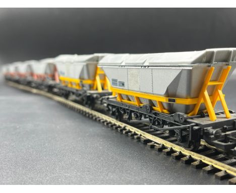 A rake of seven Hornby Wagons(800g)Hornby R039 HAA MGR coal hopper in Railfreight Coal sector silver with yellow frames - 351