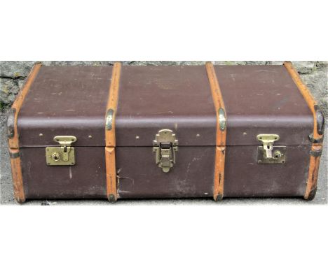 A jappaned tin trunk with painted interior and oval label F &amp; B London Made Trade Mark, together with a vintage brown fib