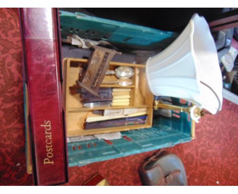 A mixed miscellaneous lot comprising a brass table lamp, a collection of postcards, a collection of flatware, etc 