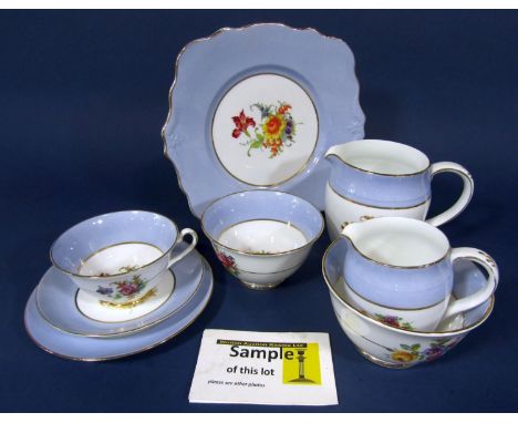 A collection of Foley China teawares with printed floral detail within a pale blue border comprising two milk jugs, two sugar