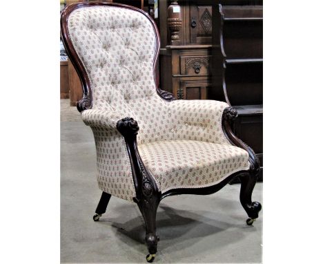 A Victorian mahogany spoonback drawing room chair with repeating floral sprig pattern upholstery on a cream ground and mahoga