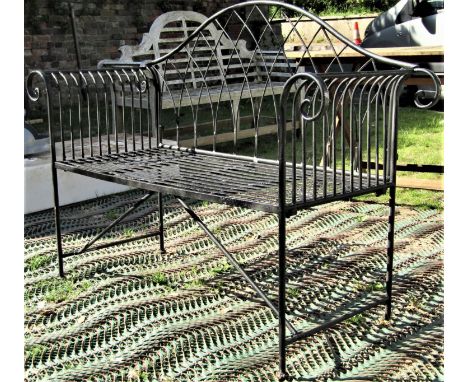 A Regency style two seat painted light metal garden bench with arched lattice back, scrolled arms, strap work seat, 133 cm wi