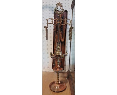 An unusual brass Huukah type pipe with four lion shaped sconces revolving top with pierced panels, 80cm high, together with a