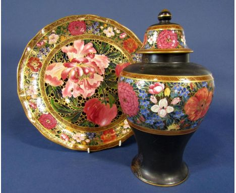 A Wilkinson pottery Rubaiyat ware charger with iris, tulip and other floral decoration to centre panel within a repeating flo