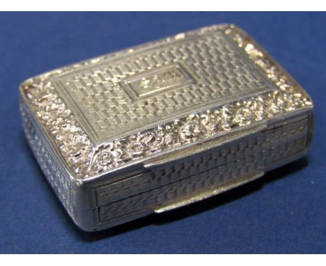 Good quality Regency vinaigrette, the hinged lid with engine turned and floral bevelled decoration, enclosing a scrolled foli