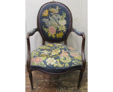 An 18th century Hepplewhite style open elbow chair with cameo shaped back, serpentine seat set within a moulded framework, wi