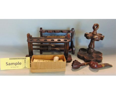 A collection of various antique pipes and pipe rack 