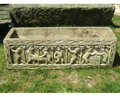A reclaimed planter of rectangular form with cherub surround, 78cm long x 26cm wide x 25cm high 