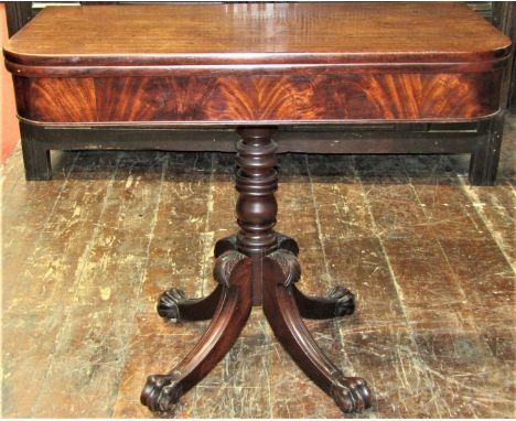 Georgian mahogany D end fold over top tea table raised on a turned pillar and four swept supports with carved lions paw feet 