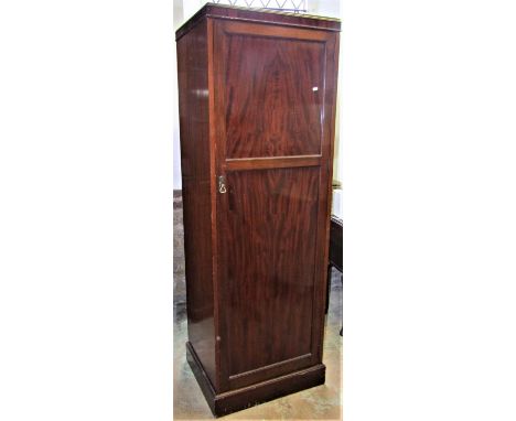 An Edwardian mahogany sentry box hall/bedroom robe by Heal &amp; Son Ltd, London, enclosed by a full length moulded panelled 