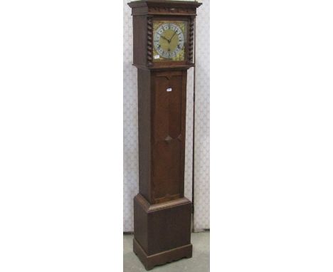 An oak grandmother clock, the square brass dial with silvered chapter ring enclosing three train movement 