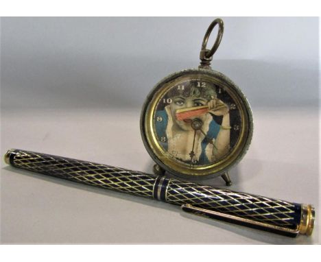 Good quality Labon fountain pen with diaper decoration, together with a further novelty wind up clock in the form of a lady u