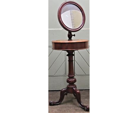 A Victorian mahogany gentleman's shaving stand, circular mirror with adjustable framework raised on a turned pillar and tripo