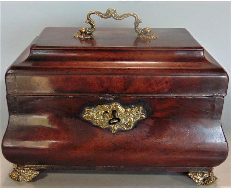 Good 19th century flame mahogany bombe shaped tea caddy, with polished brass handle, escutcheon and fancy feet, the hinged li