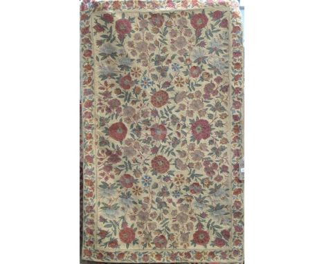 A good cruel work panel/rug with typical scrolled foliate decoration, upon a cream ground, 160 x 100 cm 