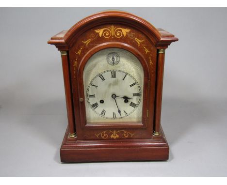 Edwardian inlaid walnut bracket type clock, the arched engraved dial with silent chime subsidiary dial, Roman numerals, twin 