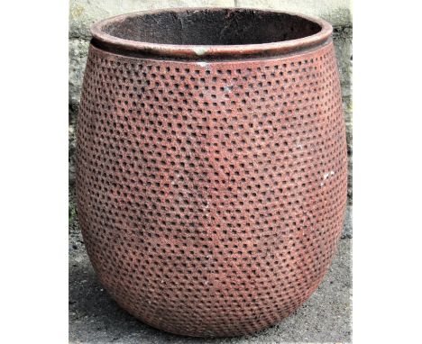 A small faux terracotta egg shaped planter with repeating blind lattice detail, with terracotta finish, 30cm diameter x 37cm 