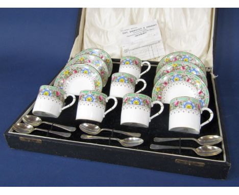 A boxed set of Royal Worcester Martley pattern coffeewares comprising six coffee cans and six saucers, together with a set of