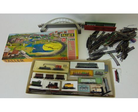 Mixed toy collection including N gauge Lima Locomotive, rolling stock and a Heller track kit  together with a remote control 