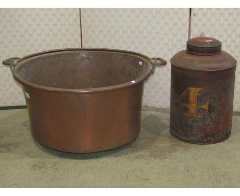 A large hammered copper pan of circular form with loose iron loop handle, 56 cm diameter together with an old painted tin sho