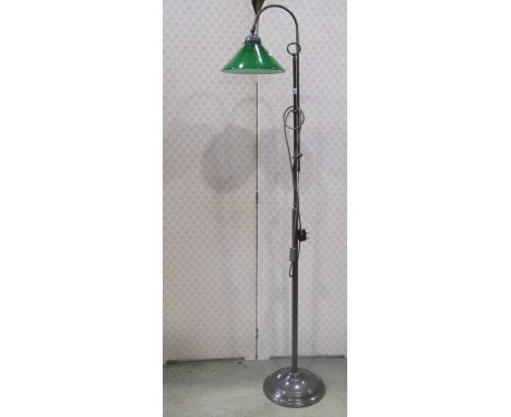 Vintage style floorstanding adjustable reading light with a dull brass finish with green glass shade 