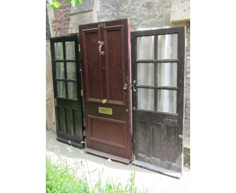 A reclaimed hardwood panelled front door, complete with brass doors knocker and fittings, 90cm wide x 212cm high, together wi