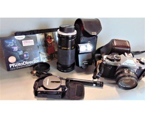 Vintage Canon AE-1 camera with Canon 50mm lens, together with a further Tamron 35/135mm lens and other accessories 