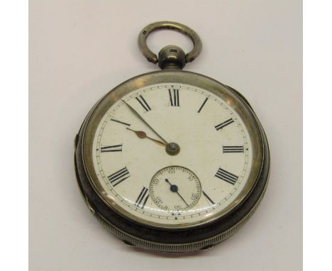 Turn of the century silver single fuse pocket watch, engine turned case and enamel dial with Roman numerals and subsidiary se