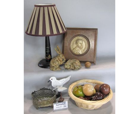 A large collection of miscellaneous items to include a basket of treen and hardstone fruit, a lacquered table lamp decorated 