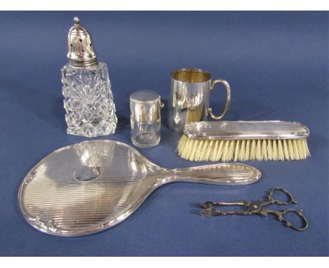 Silver backed mirror and brush with engine turned details, silver tankard, silver mounted sugar caster, silver top jar and a 