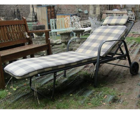 A contemporary coated light steel framed garden lounger with lattice seat and adjustable back 