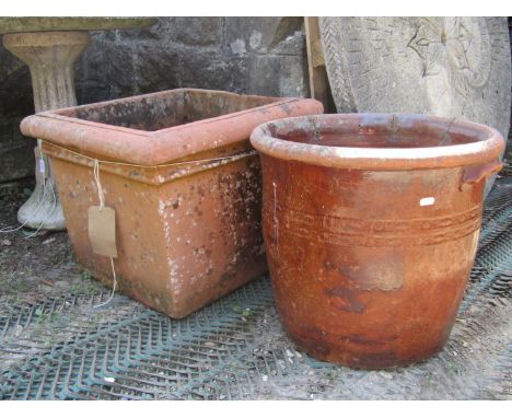 A weathered terracotta planter of square tapered form with moulded rim, 52 cm square x 41 cm high, together with a further te