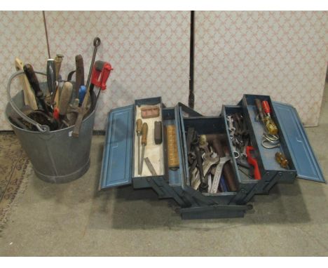 A galvanised bucket containing a quantity of hand tools, a small Victorian cast iron press, together with a steel cantilever 
