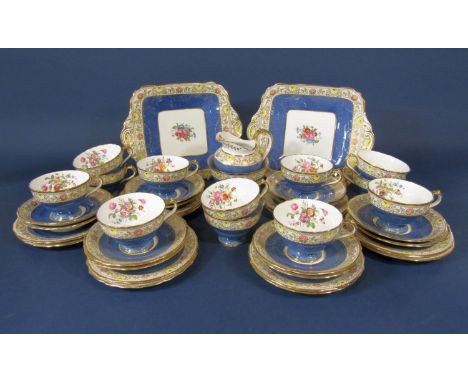 A collection of Copeland Spode teawares with printed floral sprays on a blue speckled ground comprising milk jug, sugar bowl,