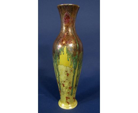 A good quality Wilkinson pottery Tibetan vase of elongated ovoid form with painted and gilded stylised floral decoration on a