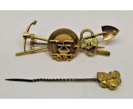 14k gold rush brooch, 6.1cm W approx, 7.8g (possible losses) and a gold nugget stick pin, 4g (2)