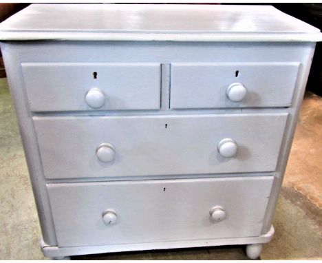 A small Victorian pine bedroom chest of two short over two long deep graduated drawers raised on simple turned bun feet with 
