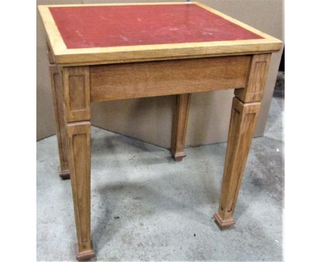A light oak library/office table with rectangular faux leather inset top raised on four square tapered and moulded legs with 