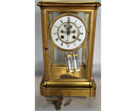 A good quality gilt brass four glass mantel clock with enamel chapter ring and open escapement, twin train movement, French d